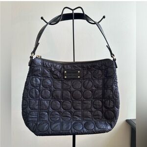 Kate Spade black nylon shoulder bag with circular quilted stitching and zip top